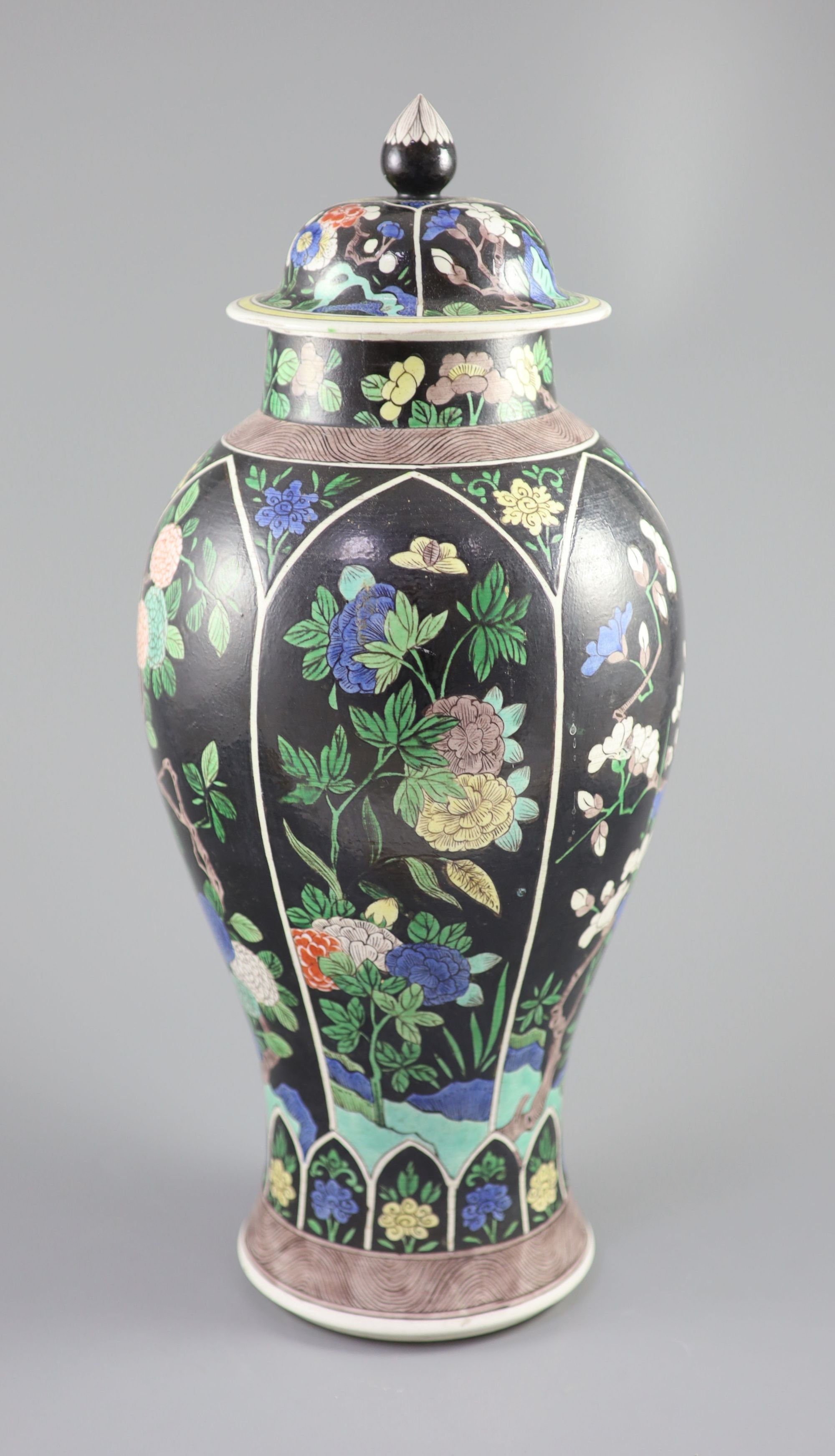 A Chinese famille noire enamelled biscuit baluster vase and cover, 19th century, 47cm high